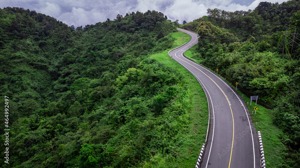Road no.3 or sky road on Root 1081 over top of mountains with green jungle in Santisuk - Bo Kluea District, Nan province, Thailand.