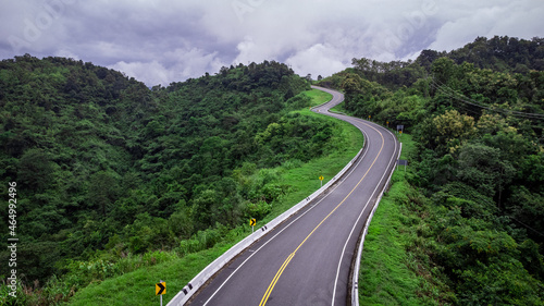 Road no.3 or sky road on Root 1081 over top of mountains with green jungle in Santisuk - Bo Kluea District, Nan province, Thailand. © chayakorn