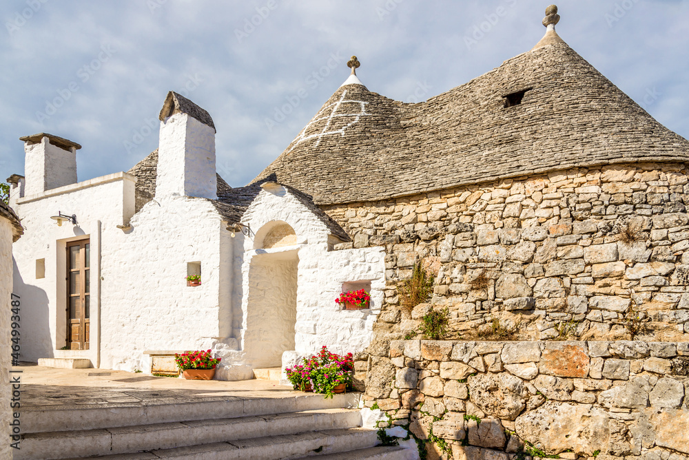 View at the Trulli buildings in the streets of Alberobello - Italy