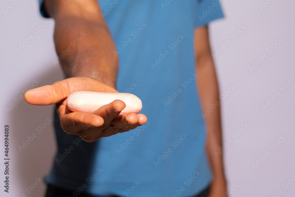 black person holding a bar of soap like they're giving it to someone black person holding a bar of soap like they're giving it to someone