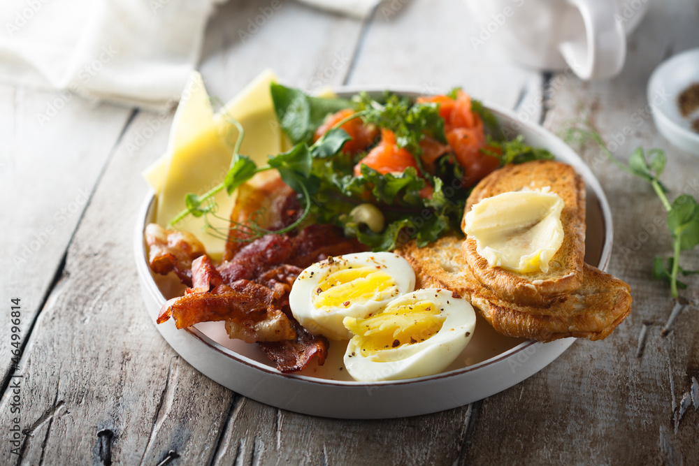 Hard boiled egg, salad and toast for breakfast Hard boiled egg, salad and toast for breakfast