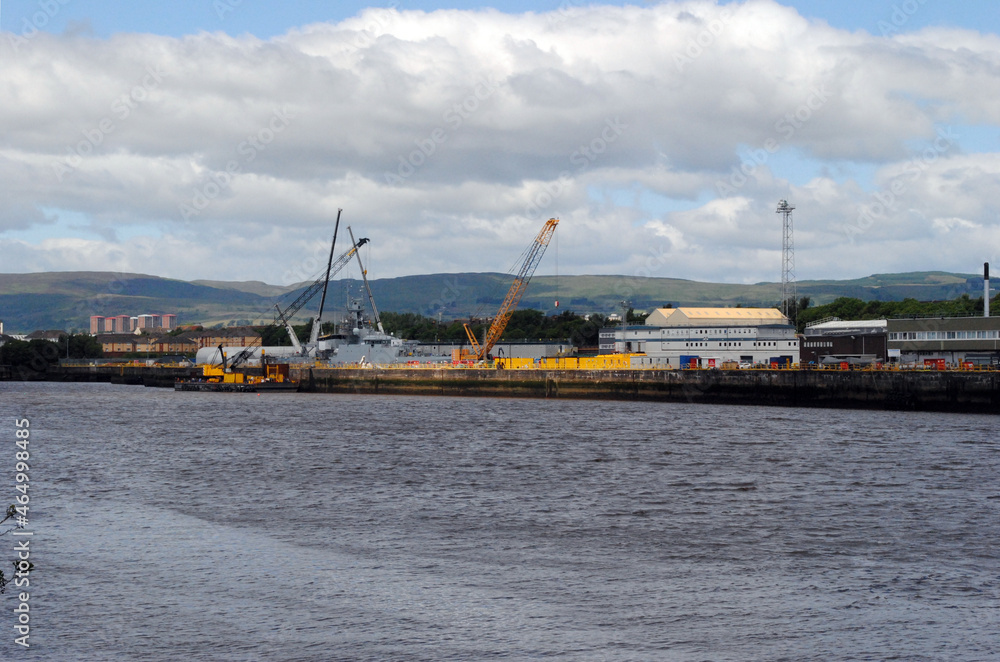 River View with Large Industrial Buildings & Dock Facilities & Cranes 