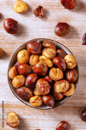 Chestnuts, shot from the top on a rustic wooden background in a bowl