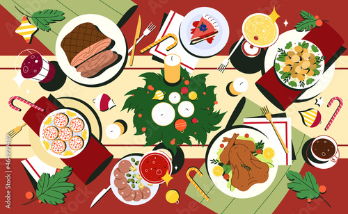 Traditional Christmas dishes in flat style. Xmas table top view with meals in plates, drink and decorated cutlery. Red tablecloth with holiday food, candles and spruce wreath of fir branches.
