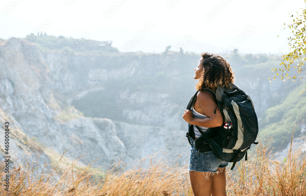 Woman traveler looking at mountain