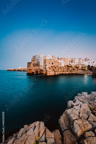 Fototapeta Naklejka Na Ścianę i Meble -  Polignano a Mare at sunset (blue hour) seen from the panoramic point in front of the village