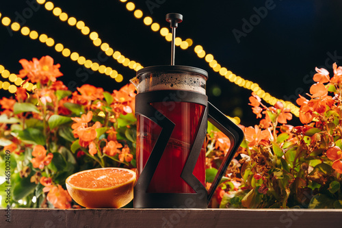 Red french press tea with grapefruit photo