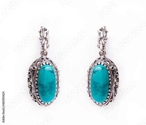 Silver jewelry earrings with chrysocolla isolated on white background.