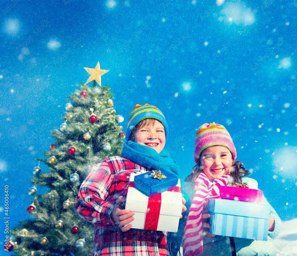 caucasian kids holding gift for christmas caucasian kids holding gift for christmas