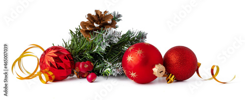 Christmas tree branch with Christmas baubles isolated on white background
