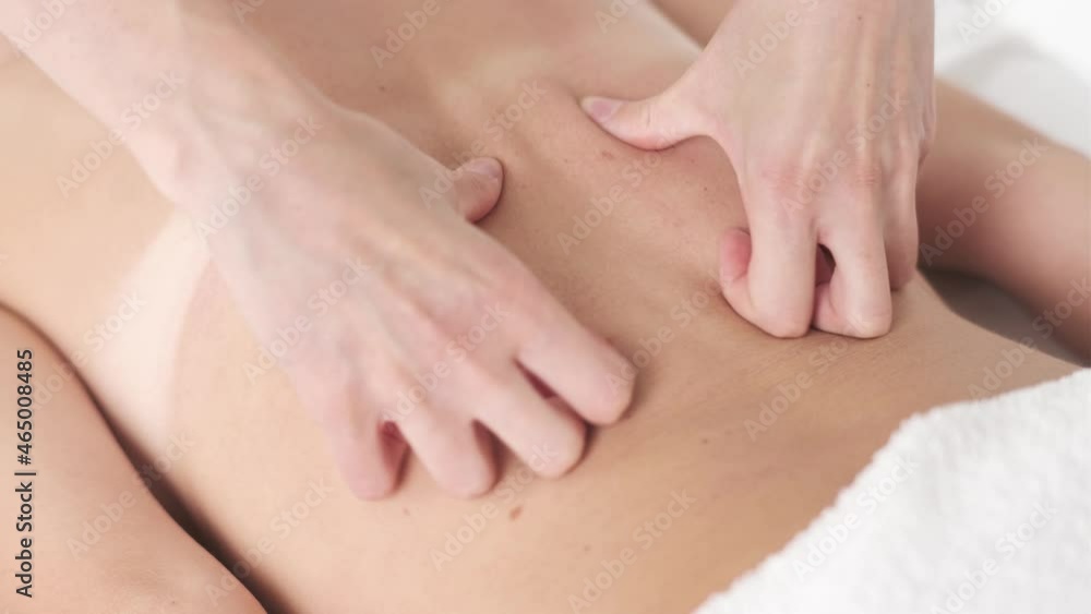 Young woman having massage in beauty spa salon, close up. Back and neck massage Young woman having massage in beauty spa salon, close up. Back and neck massage