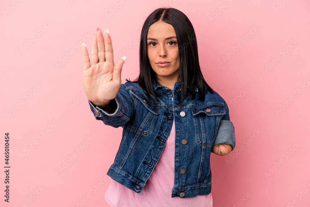 Φωτογραφία Young caucasian woman with one arm isolated on pink background standing with outstretched hand showing stop sign, preventing you