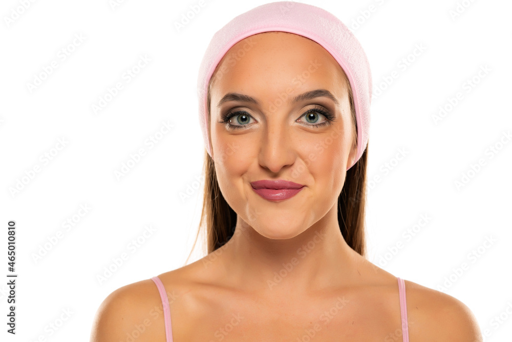 portrait of a young beautiful woman with makeup and headband portrait of a young beautiful woman with makeup and headband