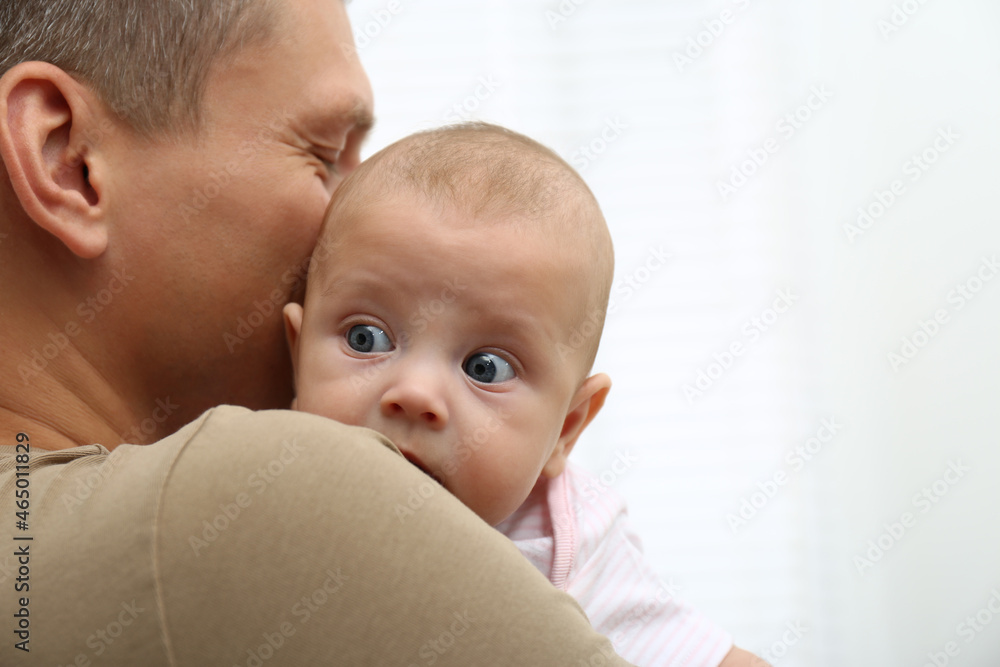 Father with his little baby on white background, closeup. Space for text Father with his little baby on white background, closeup. Space for text