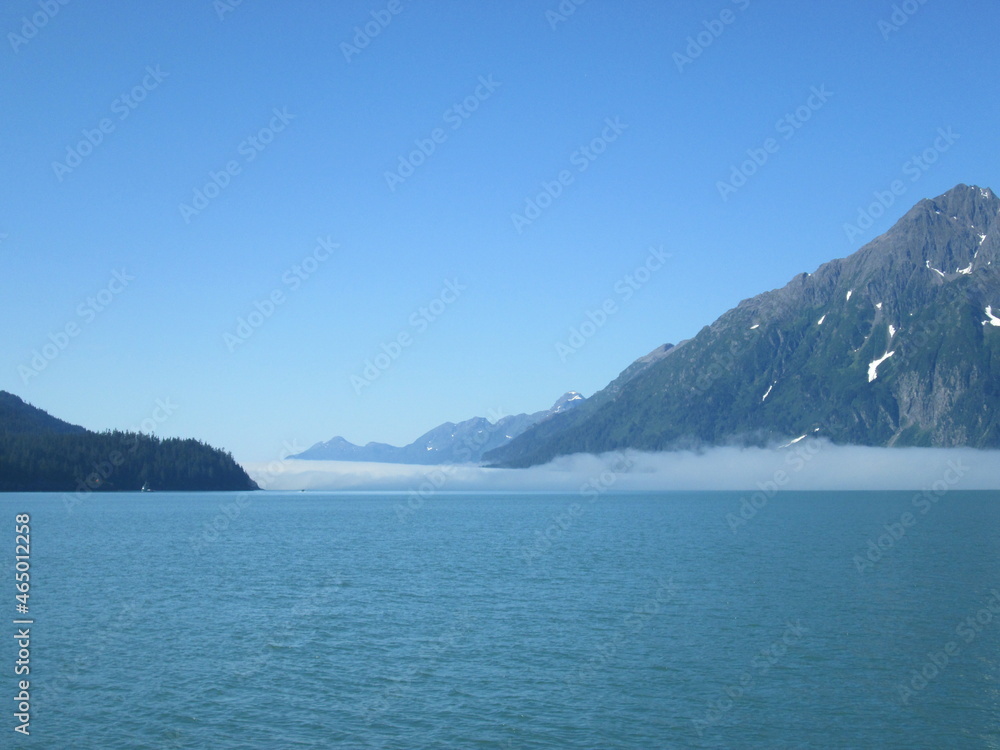 The Mountains Surrounding the Valdez Inlet in Alaska with Interesting Layered Cloud Formations