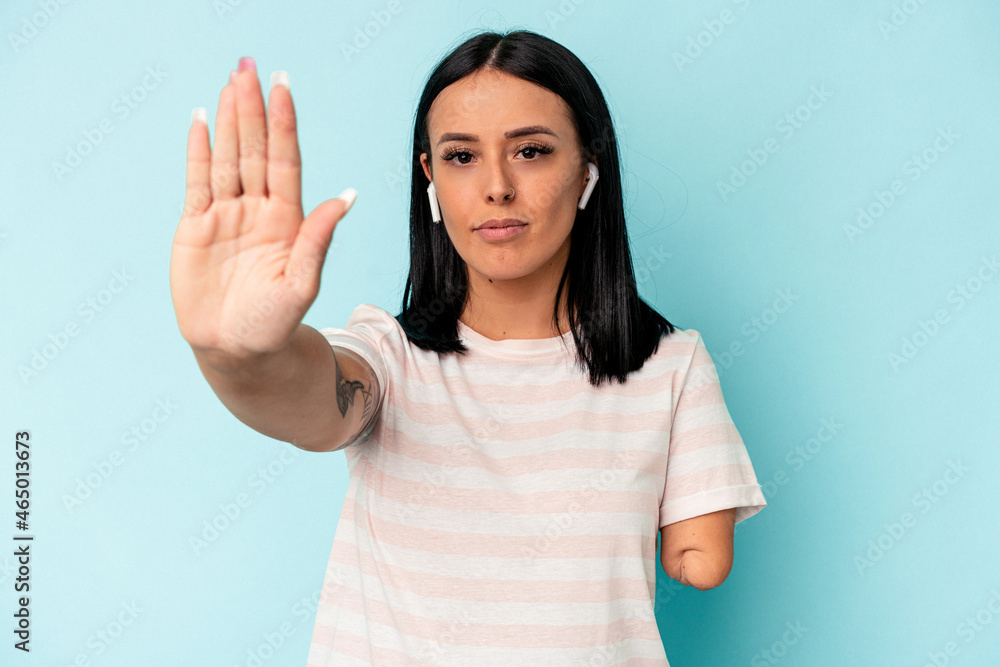 standing with outstretched hand showing stop sign, preventing you. standing with outstretched hand showing stop sign, preventing you.