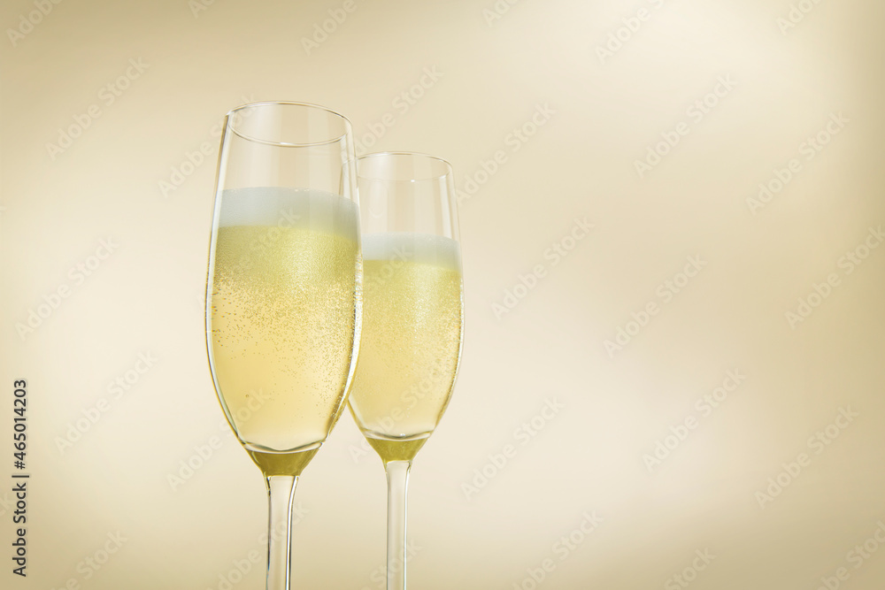Champagne glasses. The second glass is a little bit blurred.