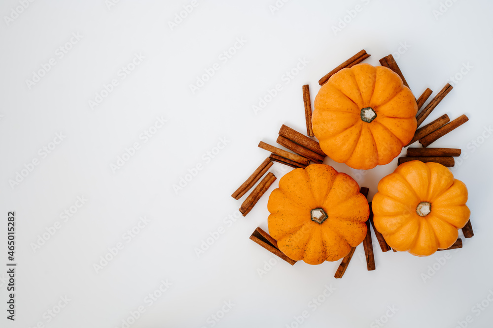 three pumpkins with cinnamon