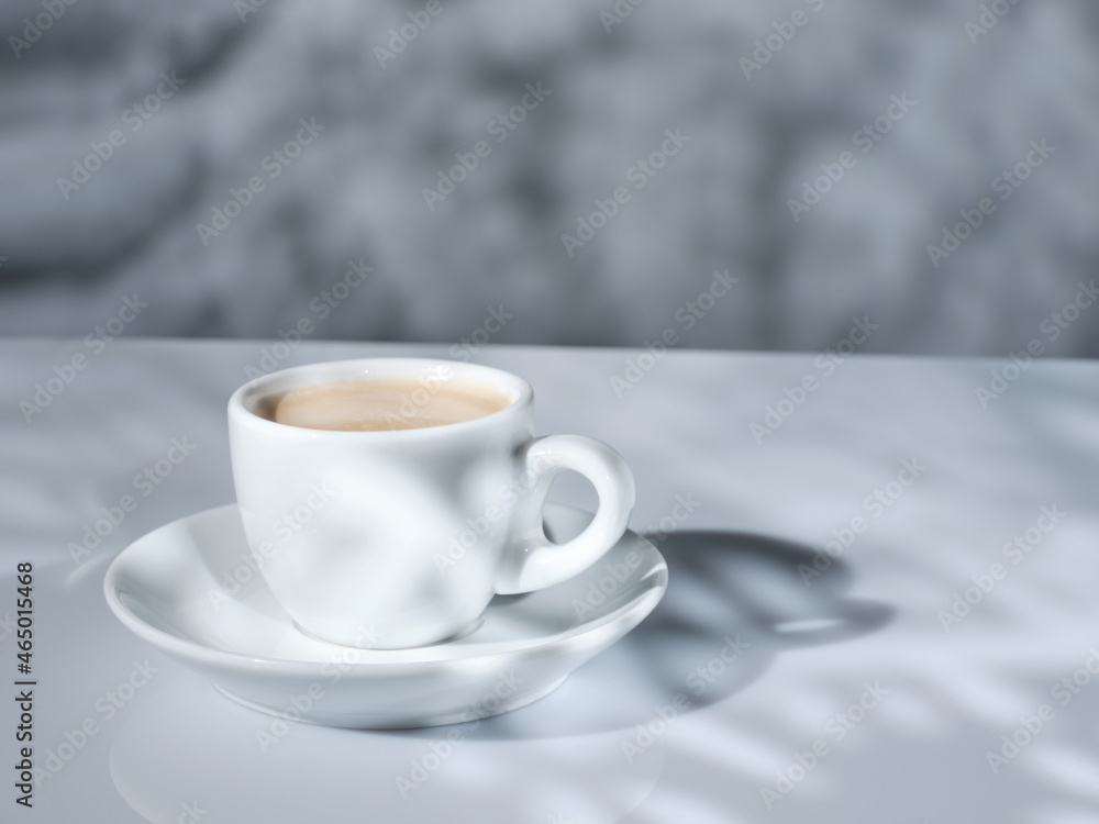 White cup of coffee with natural morning light White cup of coffee with natural morning light