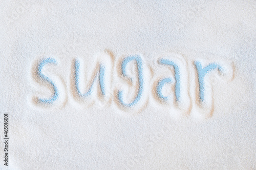 Bilde på lerret Word sugar hand lettering on a placer of refined white sugar