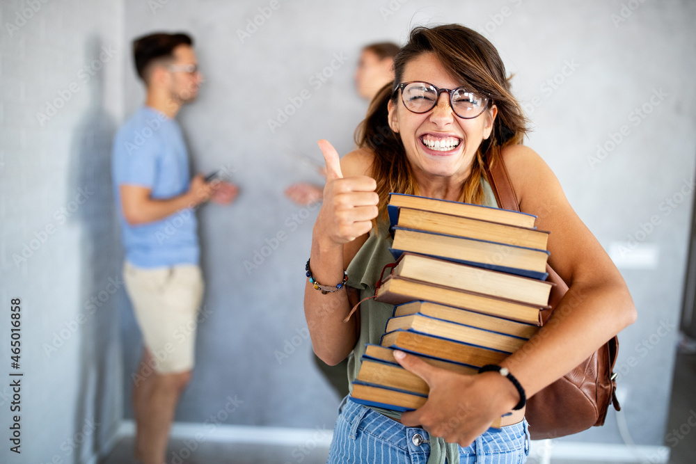 Stylish nerd girl with many books. Education, study, people, university concept. Stylish nerd girl with many books. Education, study, people, university concept.