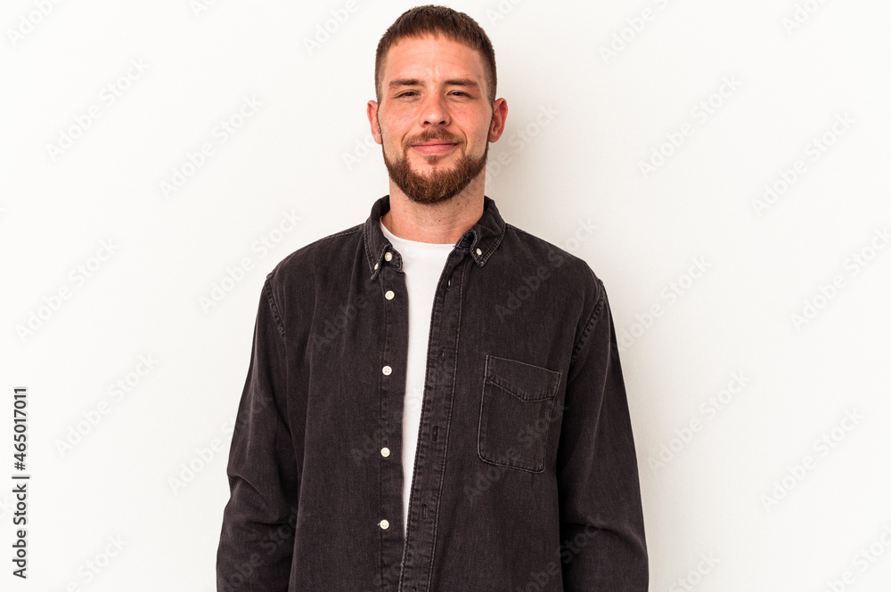 Young caucasian man with diastema isolated on white background laughs and closes eyes, feels relaxed and happy. Young caucasian man with diastema isolated on white background laughs and closes eyes, feels relaxed and happy.