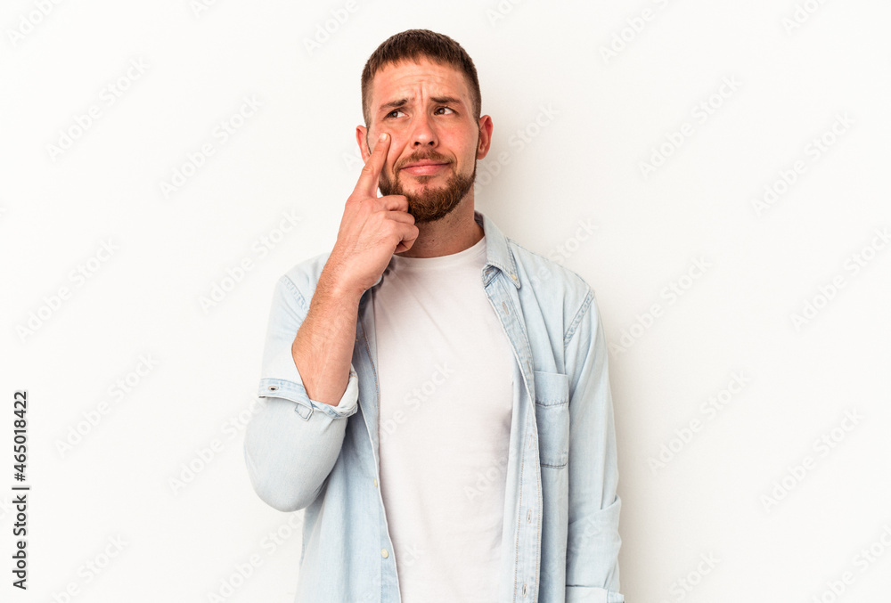 Young caucasian man with diastema isolated on white background crying, unhappy with something, agony and confusion concept. Young caucasian man with diastema isolated on white background crying, unhappy with something, agony and confusion concept.