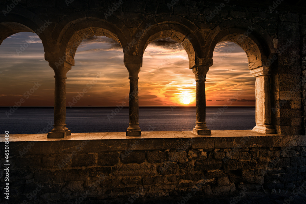 Portovenere or Porto Venere. Beautiful sunset over the Sea, view from the porch of the medieval Church of San Pietro (St. Peter, 1198), UNESCO world heritage site. La Spezia, Liguria, Italy, Europe.
