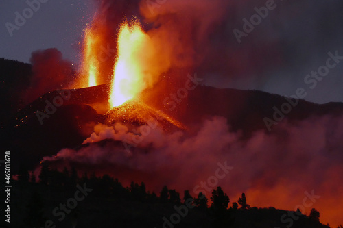 La Palma, Santa Cruz de Tenerife, Spain - October 21, 2021: Cumbre Vieja volcano, volcanic eruption at night with fire, and lava. photo
