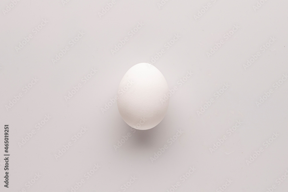 lonely egg on a white background, food art concept lonely egg on a white background, food art concept