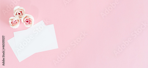 Blank white greeting card with pink rose flowers. Mock up. © Marcela Ruty Romero
