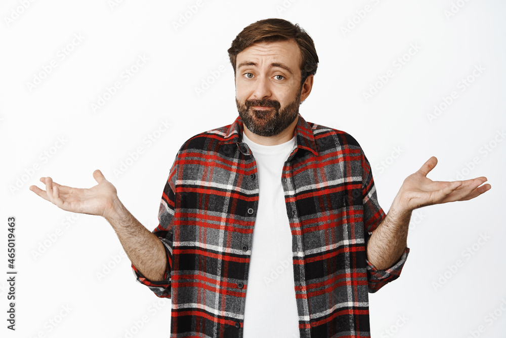 I dont know. Clueless bearded guy shrugging shoulders, apologizing, dont know anything, being unable to help, standing over white background I dont know. Clueless bearded guy shrugging shoulders, apologizing, dont know anything, being unable to help, standing over white background