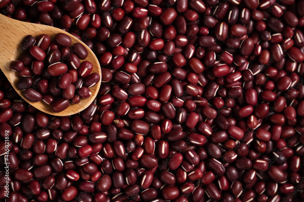 Raw adzuki red bean as background with spoon. Raw adzuki red bean as background with spoon.