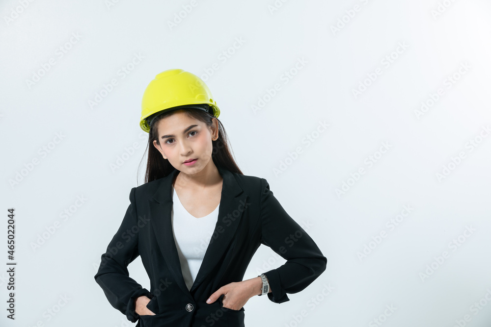 Asian women engineering inspecting and working and holding blueprints on white background Asian women engineering inspecting and working and holding blueprints on white background