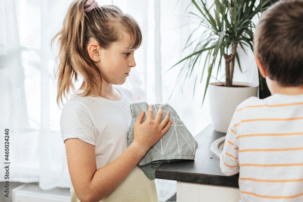 Cute Caucasian Girl And Boy Helping With Kitchen Cleaning Cute Caucasian Girl And Boy Helping With Kitchen Cleaning