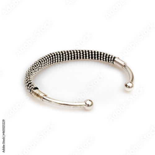 Modern silver bracelet isolated on a white background