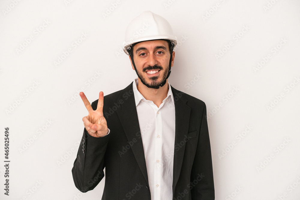 Young architect man wearing a construction helmet isolated on white background showing number two with fingers.