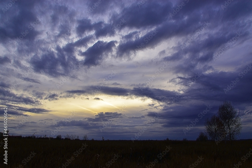 Heavy autumn clouds in the sky at sunset