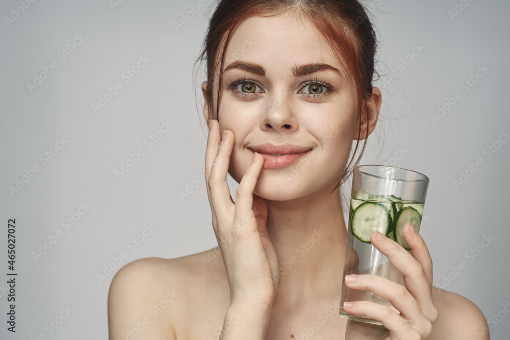 woman with cucumber drink health vitamins close-up woman with cucumber drink health vitamins close-up