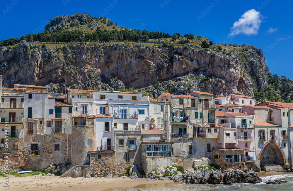Buildings and La Rocca mount in Cefalu town on Sicily Island, Italy
