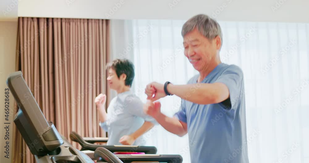 elder couple run on treadmill elder couple run on treadmill