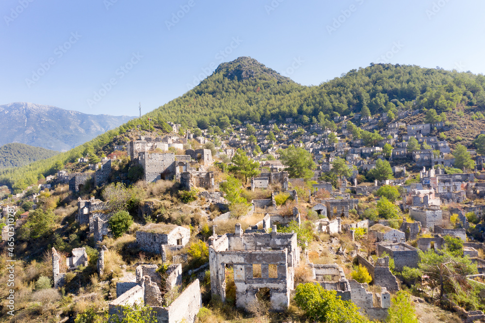 Kayaköy Abandoned ghost town, stone houses and ruins. The site of the 18th century Ancient Greek city of Karmilissos. Aerial view, Fethiye - TURKEY