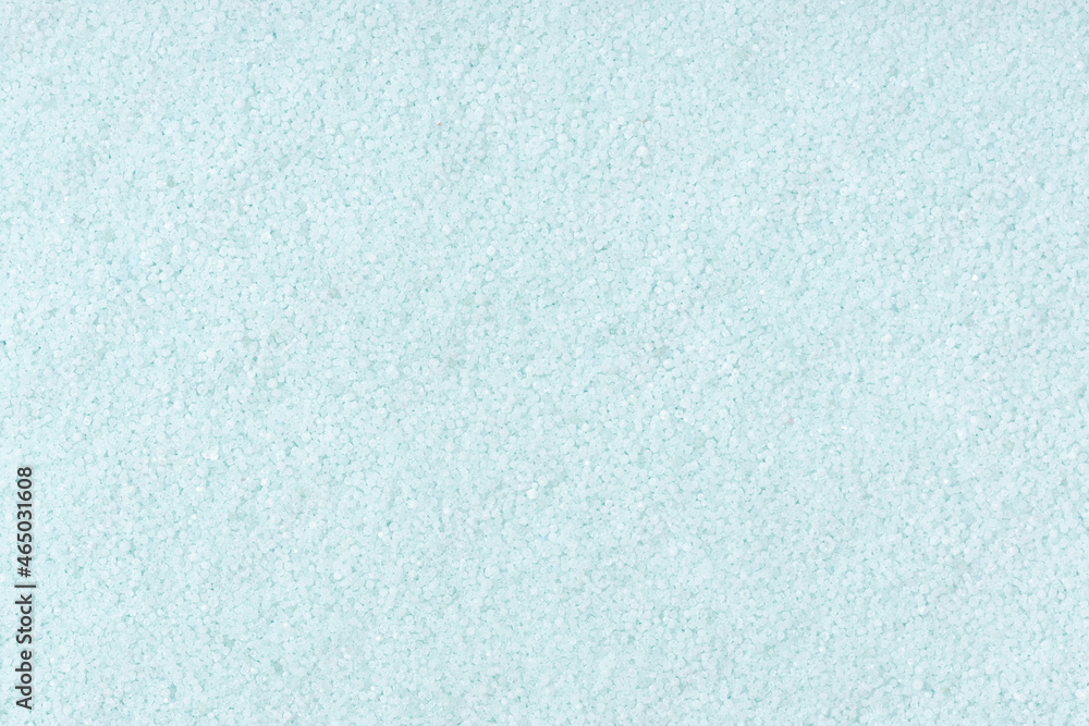 Obraz premium Turquoise colored sand background texture. Full frame