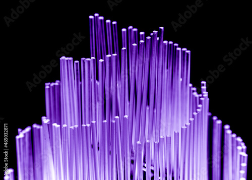 Glowing glass rods in purple on a black background.
