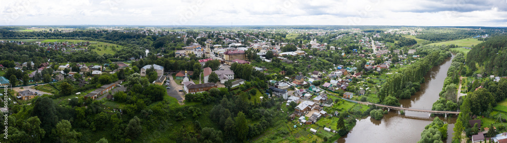 Panoramic view from a height of the Russian summer landscape with a church and a river in central Russia, Borovsk