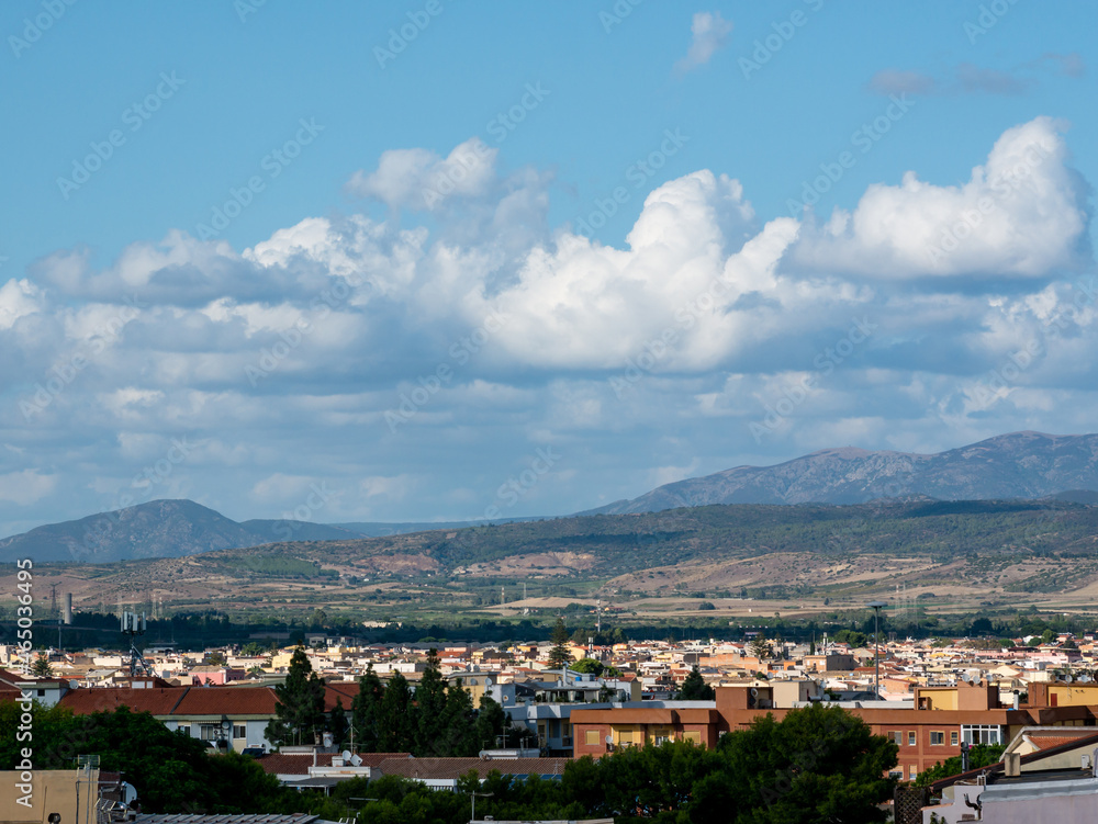 panoramic view of a small Italian town with mountains