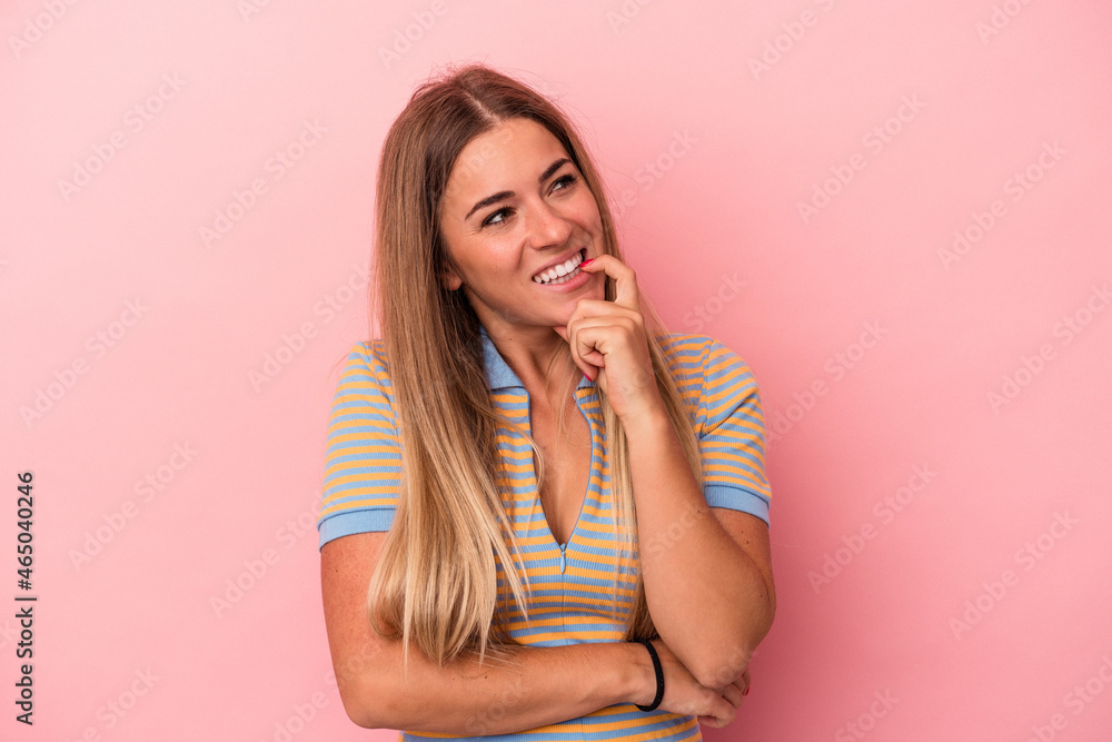 Young Russian woman isolated on pink background raising fist after a victory, winner concept. Young Russian woman isolated on pink background raising fist after a victory, winner concept.