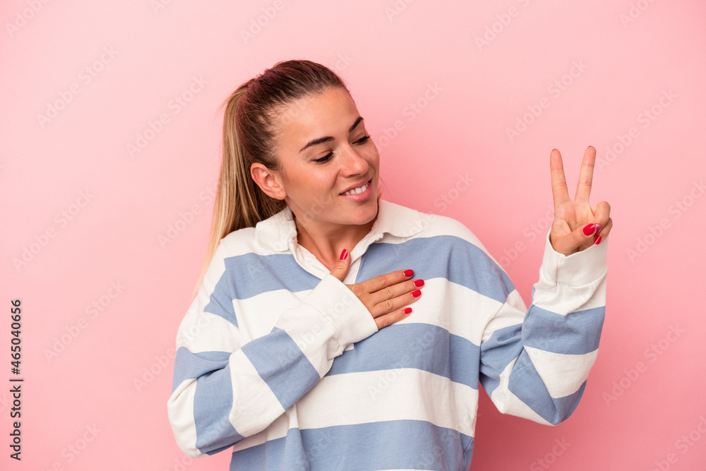 Young Russian woman isolated on pink background thinking and looking up, being reflective, contemplating, having a fantasy. Young Russian woman isolated on pink background thinking and looking up, being reflective, contemplating, having a fantasy.