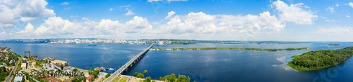 a panoramic view of the banks of the Volga River near Saratov, an automobile bridge across the river in the city limits