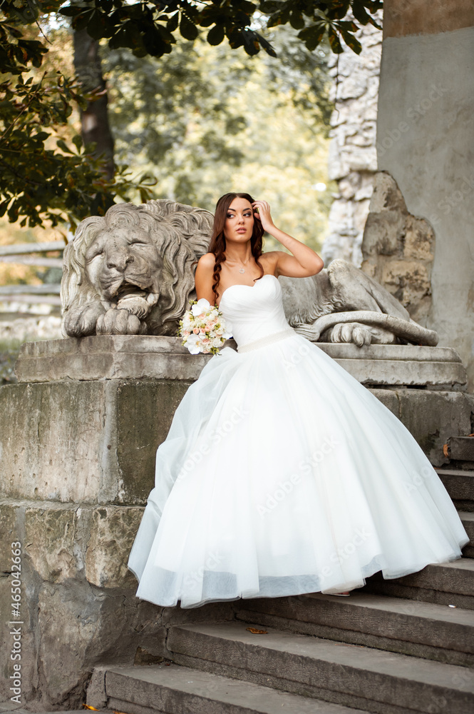 Bride posing in the summer old city